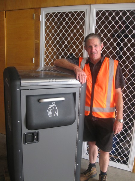 Parks Operations Supervisor Neville Brodie standing next to the new bin